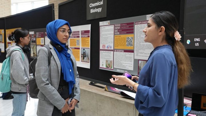 A photo of 2 students talking at the Career Expo.