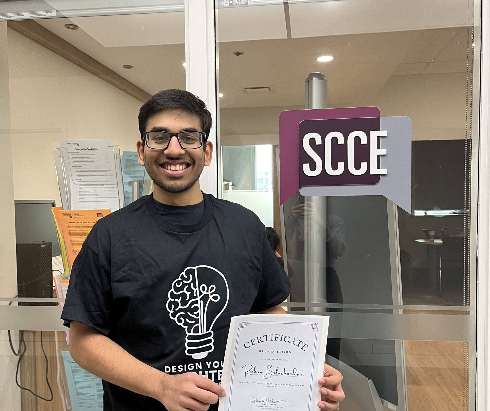 Photo of student holding a certificate.