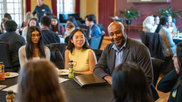 Photo of people chatting at a networking breakfast.